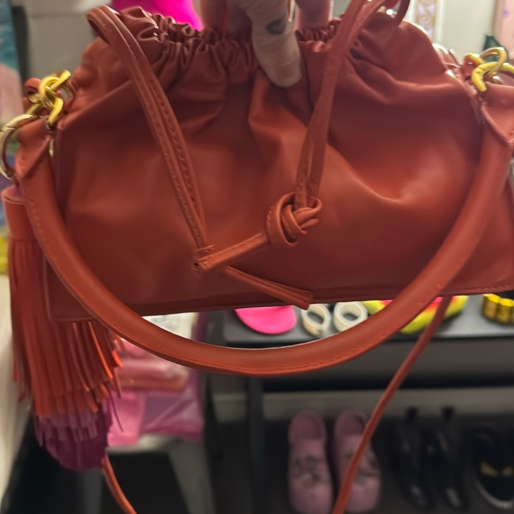 Yuzefi Orange Drawstring Crossbody Bag with Tassel